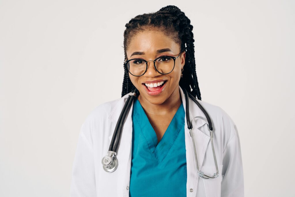 Portrait of a smiling female doctor in a lab coat and stethoscope, exuding confidence.